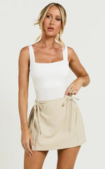 Camilla Mini Skirt - Mid Waist Pleated Back Bow Detail Skirt in Stone