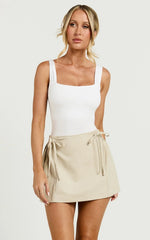 Camilla Mini Skirt - Mid Waist Pleated Back Bow Detail Skirt in Stone